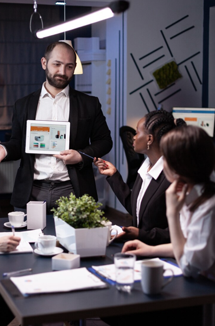 Consultant reviewing a cloud architecture diagram on a digital display